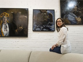Olga Rybalko is a representational painter who grew up in Ukraine. In 2021, Rybalko had an exhibition of paintings inspired by her native Crimea, an area of Ukraine that was annexed by Russia in 2014. Rybalko is pictured at Dwell Living in Vancouver's Yaletown on Thursday with three paintings from the Crimea series.