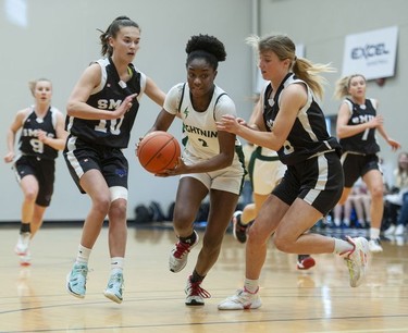 Langley Christian Lightning's Laine Shelvey drives the ball downcourt during play against the St. Michaels University School Blue Jags.