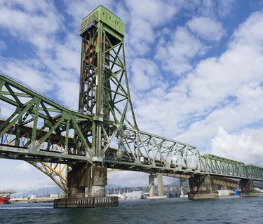 The Tsleil-Waututh Nation have commissioned reports documenting the erosion of the shoreline around Burrard Inlet, changes to sea life and industrial pollution since contact. Pictured is the Second Narrows rail bridge Tuesday, March 8, 2022.