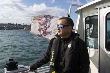 The Tsleil-Waututh Nation have commissioned reports documenting the erosion of the shoreline around Burrard Inlet, changes to sea life and industrial pollution since contact. Pictured is Ernie 'Bones' George, chief administrative officer of the Tsleil-Waututh Nation onboard the research vessel Say Nuth Khaw Yum Tuesday, March 8, 2022.