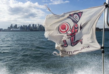 The Tsleil-Waututh Nation have commissioned reports documenting the erosion of the shoreline around Burrard Inlet, changes to sea life and industrial pollution since contact. Pictured is the Tsleil-Waututh Nation flag onboard the research vessel Say Nuth Khaw Yum in Burrard Inlet March 8, 2022.