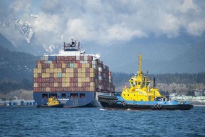 The Tsleil-Waututh Nation have commissioned reports documenting the erosion of the shoreline around Burrard Inlet, changes to sea life and industrial pollution since contact. Pictured is a cargo ship loaded with containers as seen from Burrard Inlet March 8, 2022.