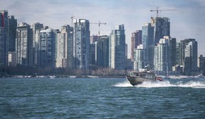 The Tsleil-Waututh Nation have commissioned reports documenting the erosion of the shoreline around Burrard Inlet, changes to sea life and industrial pollution since contact. Pictured is a boat navigating the Burrard Inlet March 8, 2022.