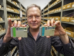 Wayne Thompson, general manager of ACR Systems, holds Smart Reader Plus temperature data loggers in Surrey on March 10.
