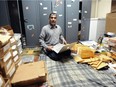 Jehan Zeb with some of the coins and banknotes he sells online from the basement of his home in Vancouver on March 15.