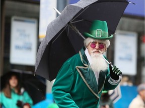 Up to 20 millimetres of rainfall is expected throughout the day, with temperatures steady around 7 degrees and clouds overnight. A man dressed for the occasion is pictured in this 2014 file photo during a rainy St. Patrick's Day parade in Vancouver, B.C.