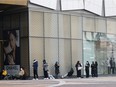 Shoppers line up outside a Chanel store in Seoul, South Korea, March 16, 2022.