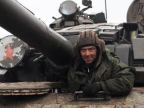 A member of a pro-Russian militia is seen inside a tank in the self-proclaimed Luhansk People's Republic (LNR) in Ukraine, on Feb. 27, 2022.