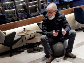 Sanctioned Russian oligarch Roman Abramovich sits in a VIP lounge before a jet linked to him took off for Istanbul from Ben Gurion international airport in Lod near Tel Aviv, Israel, March 14, 2022.