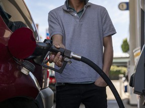 A driver refuels at a Chevron gas station in San Francisco, California, U.S., on Monday, March 7, 2022.