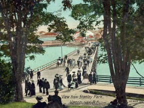 A postcard circa 1910 shows the bridge that linked Downtown Vancouver with Stanley Park before the park causeway was built between 1916 and 1919. The water would be Lost Lagoon, back when it was saltwater — it's now a freshwater lake.