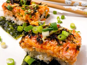 Sushi bake is served warm, in a casserole dish, family style. It’s a deconstructed sushi roll served on top of Nori. It’s a layer of deliciously seasoned sushi rice, creamy and cheesy crabmeat, topped with a generous drizzle of Japanese kewpie mayo, unagi sauce and then baked until slightly caramelized.