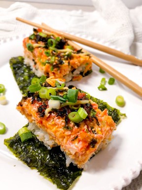 Sushi bake is served warm, in a casserole dish, family style. It’s a deconstructed sushi roll served on top of Nori. It’s a layer of deliciously seasoned sushi rice, creamy and cheesy crab meat, topped with a generous drizzle of Japanese kewpie mayo, unagi sauce and then baked until slightly caramelized.