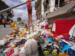 Mohawk Institute on Truth and Reconciliation Day adorned with footwear, children's toys and messages of love and hope ever since the discovery of the remains of 215 Indigenous children at a former residential school in Kamloops, B.C.