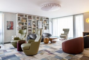For the teen lounge, interior designer Cathy Radcliffe chose furniture to appeal both to a teen’s privacy (high-back swivel chairs) and small group settings for games and watching films. Muse Sticks ceiling light by Axolight.
