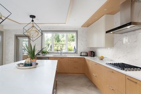 An island with breakfast bar area in the spacious kitchen.