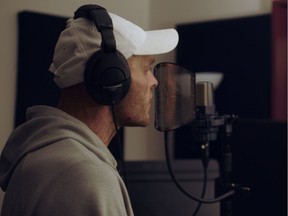 Musician D'Skyz records in a studio for 100 Block Rock II.