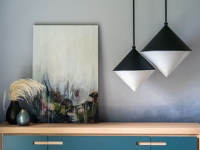 The geometric pendants in this room designed by Simply Home Decorating are a nod to the coming 1970s and '80s wave in design.