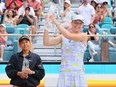 Iga Swiatek of Poland celebrates with the Butch Buchholz Trophy after defeating Naomi Osaka of Japan in the Women's Singles final at Hard Rock Stadium on April 2, 2022 in Miami Gardens, Fla.