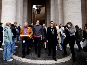 Newly elected Dene National Chief Gerald Antoine, Metis National Council president Cassidy Caron and Inuit community President Natan Obed walk in St. Peter's square after an audience with Pope Francis, at the Vatican, April 1, 2022.