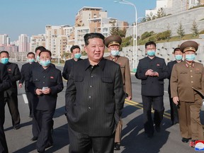 This undated picture and released by the Korean Central News Agency (KCNA) on April 3, 2022 shows North Korean leader Kim Jong Un in Qionglou-dong, Jungang District, Pyongyang City.