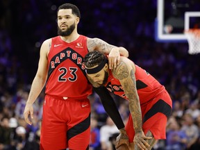 Raptors' Fred VanVleet (left) and Gary Trent Jr. look on during the third quarter of Game 1 against the Philadelphia 76ers at Wells Fargo Center on Saturday, April 16, 2022 in Philadelphia.