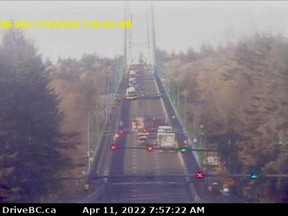 Emergency vehicles can be seen at a vehicle incident on the Lions Gate Bridge just before 8 am Monday.