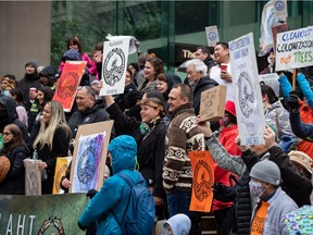 Members of the Nuchatlaht First Nation and supporters rally outside B.C. Supreme Court before the start of an Indigenous land title case, in Vancouver, on Monday, March 21, 2022.