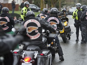 Police monitor the annual Hell's Angels' Screwy Ride in Vancouver in 2019. A B.C. member of the Nomad's club, who recently was at the 2022 version of the ride, has been arrested and the U.S. is seeking his extradition.