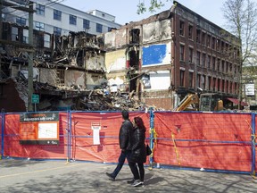 The demolition of the Winters Hotel, destroyed during a fire April 11, was halted after two bodies were found in the rubble Friday. Police and coroners service continue to investigate.