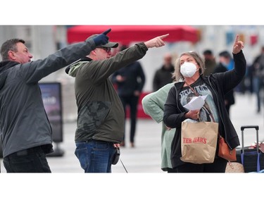 Passengers disembark from The Koningsdam cruise ship at Canada Place  in Vancouver, BC., on April 10, 2022.