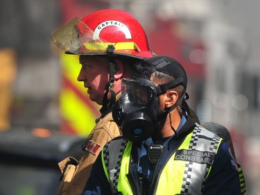 The fire was upgraded to a four-alarm blaze around noon as more crews were called in and smoke continued to fill the skies around downtown Vancouver.