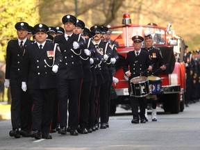 Vancouver firefighters' line-of-duty death memorial for Capt. Steve Letourneau arrives at St. Andrew's Wesley United Church on Thursday.
