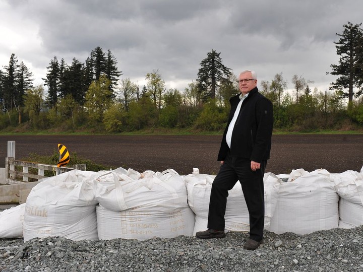  Abbotsford Mayor Henry Braun stands on a repaired dike that broke during November’s flooding in Sumas Prairie.