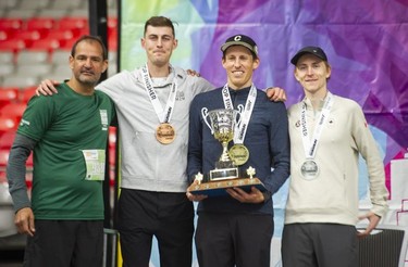 2022 Vancouver Sun Run men's race winner Lucas Bruchet (second from right) with runner-up Benjamin Preisner (right) and third-place finisher Justin Kent (second from left).
