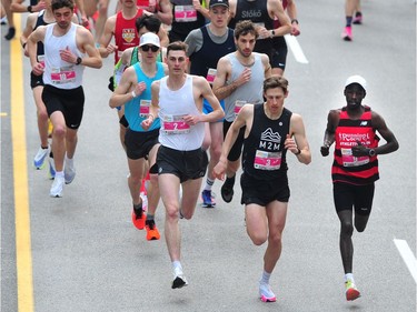 Elite runners lead the pack at the 2022 Sun Run on Georgia St. in Vancouver on April 24, 2022.