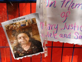 A makeshift memorial Monday for Mary Garlow, metres away from the demolition at the corner of Abbott and Water streets.