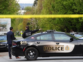 Vancouver police at the scene where a man died following an exchange of gunfire with Vancouver Police on April 28.