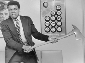 Another shot of Muhammad Ali taking a fire ax to be photographed at the Vancouver airport on April 21, 1972. Ralph Bower/Vancouver Sun