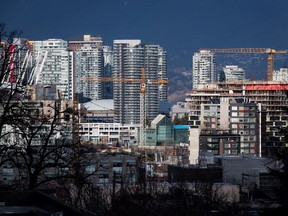 Construction cranes tower over southeastern False Creek in Vancouver.