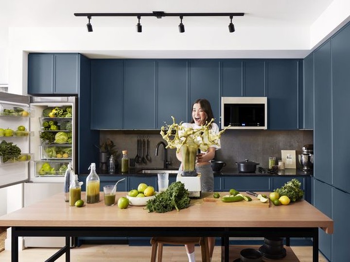  The kitchen cabinets will be clean-lined with a slim shaker profile available in one of two colour schemes: a rich navy hue or a lighter oyster grey complemented by a dramatic, dark backsplash, matte black hardware and faucet.