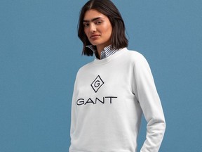 A model wears pieces from the apparel brand Gant.