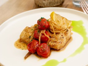 Poached Cod with cherry tomatoes and chili oil. Handout/Jamie-Lee Fuoco (single use)