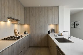Kitchens in the homes at Esquimalt Town Square feature Kohler faucets and sinks, quartz countertops with polished tile backsplashes and a Bosch gas cooktop.