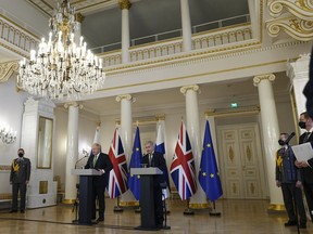 UK Prime Minister Boris Johnson, left, and Finland's President Sauli Niinisto meet the media at the Presidential Palace on May 11, 2022 in Helsinki, Finland. Britain has signed a security assurance with Sweden and its neighbor Finland, both pondering whether to join NATO following Russia's invasion of Ukraine, pledging to "bolster military ties" in the event of a crisis and support both countries should they come under attack.