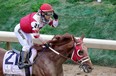 Jockey Sonny Leon reacts after Rich Strike wins the 148th running of the Kentucky Derby at Churchill Downs on May 07, 2022 in Louisville, Kentucky.