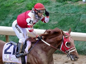 Jockey Sonny Leon reacts after Rich Strike wins the 148th running of the Kentucky Derby at Churchill Downs on May 07, 2022 in Louisville, Kentucky.