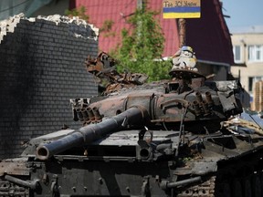 A children's cuddly toy sits on top of a destroyed Russian main battle tank, next to war damaged homes, on May 24, 2022 in Hostomel, Ukraine. As Russia concentrates its attack on the east and south of the country, residents of the Kyiv region are returning to assess the war's toll on their communities. The towns around the capital were heavily damaged following weeks of brutal war as Russia made its failed bid to take Kyiv.