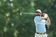 Canadian Adam Hadwin plays his shot from the 14th tee during the first round of the PGA Championship at Southern Hills Country Club in Tulsa, Oklahoma.