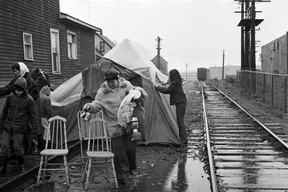 Single mothers living at the Raymur Place Social Housing Project (now Stamps Place) in the Downtown Eastside remove their protest camp blocking train tracks to the Port of Vancouver after the CPR agrees to safety measures for local children.  A pedestrian overpass to Admiral Seymour school was eventually built.  March 26, 1971. Glenn Baglo/Vancouver Sun